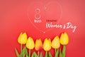 International WomenÃ¢â¬â¢s Day with flowers and heart shape necklace on red background Royalty Free Stock Photo